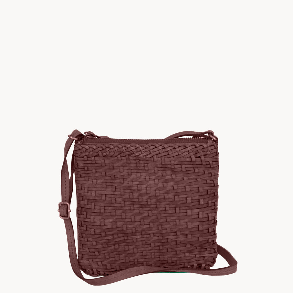 Brown woven handbag on a white background