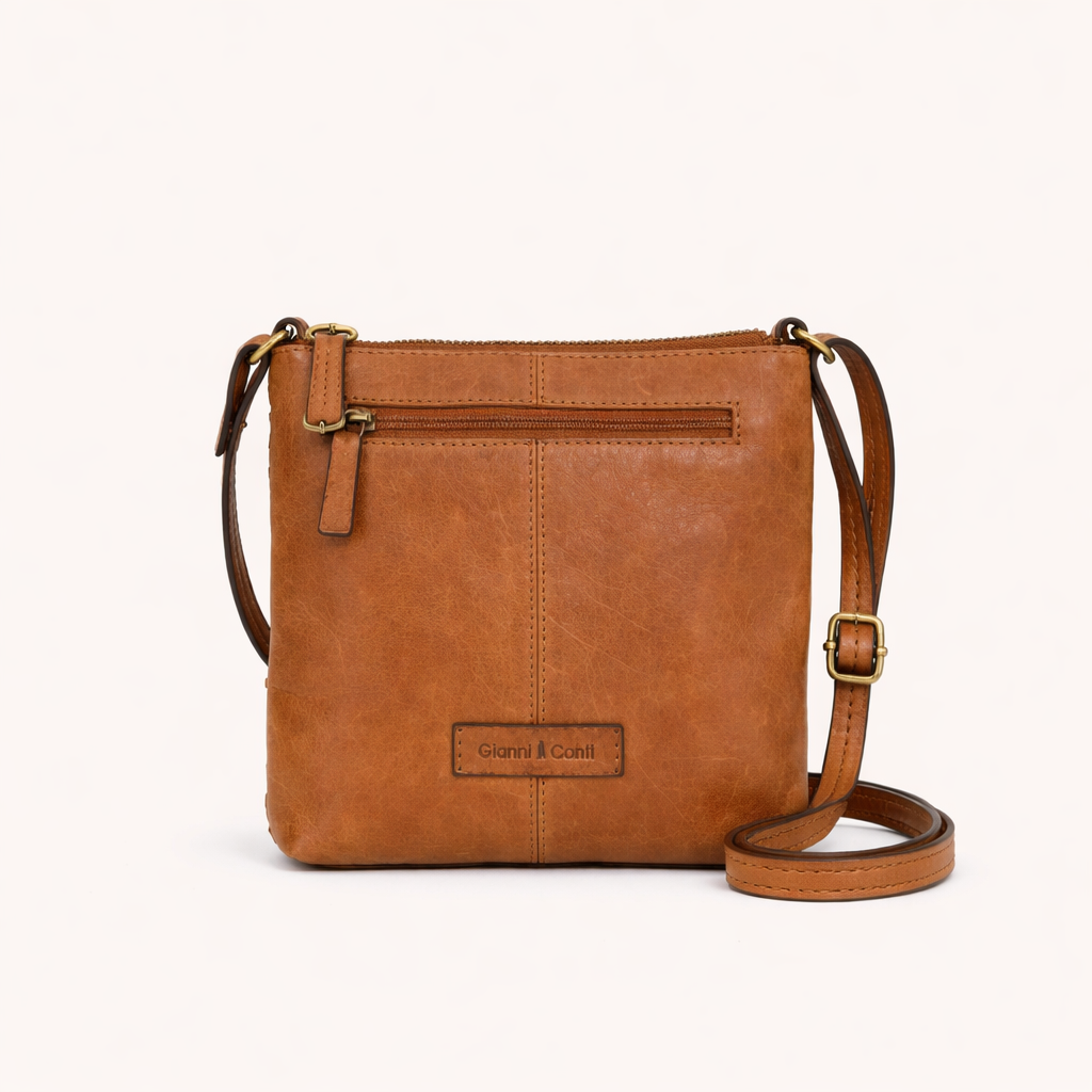 Brown leather crossbody bag on a white background