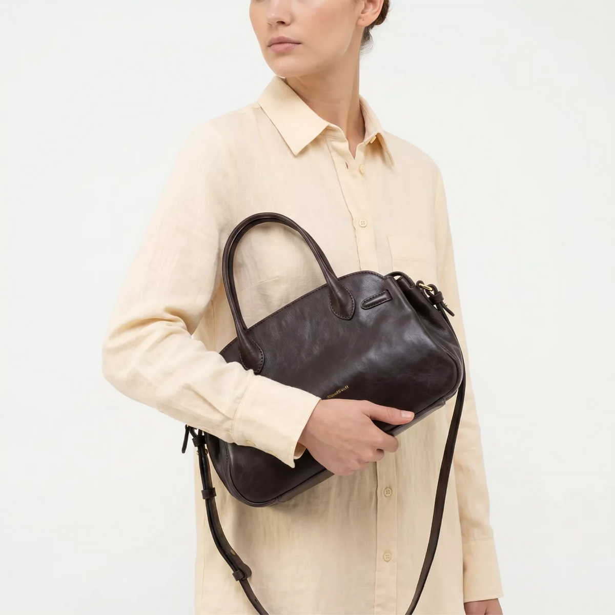 Gianni Conti Leather Bowling Bag in Chocolate - carried on the arm by model