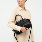 Gianni Conti Leather Bowling Bag in Black - carried on the arm by model