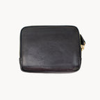 Black leather purse with gold zipper on a white background