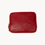 Red leather purse with gold zipper on a white background