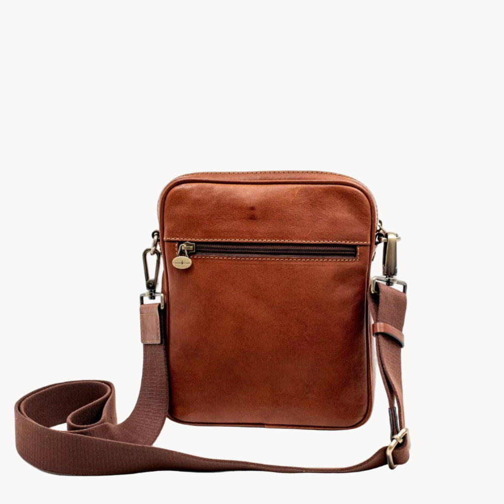 Brown leather crossbody bag on a white background
