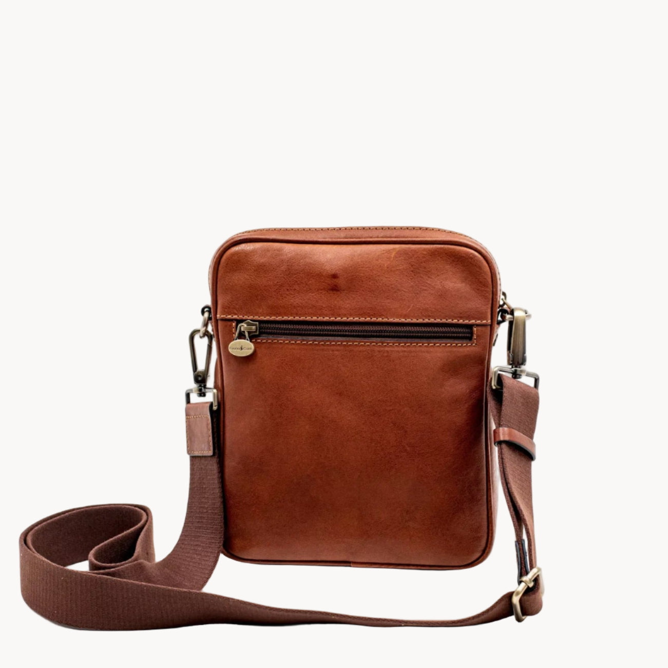 Brown leather crossbody bag on a white background