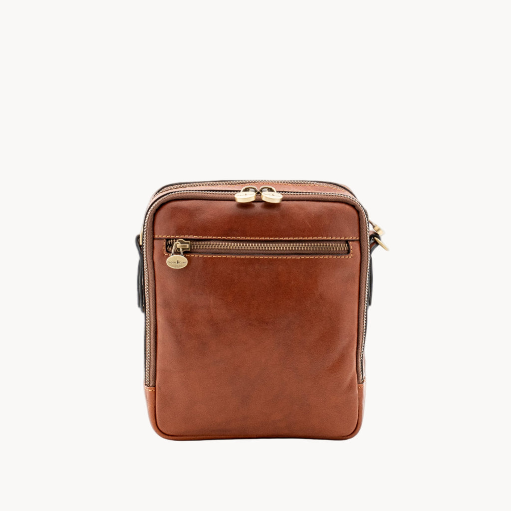 Brown leather crossbody bag on a white background