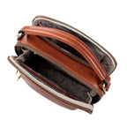 Brown leather handbag with open top on a white background