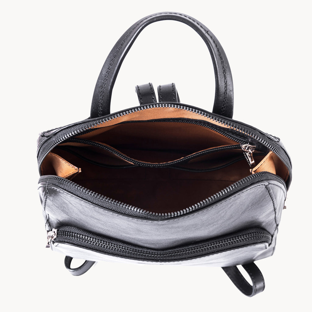 Black handbag with open front zipper on a white background