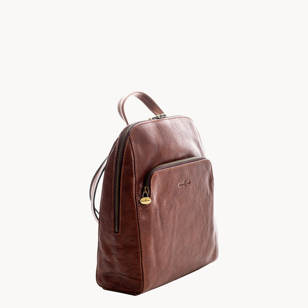 Brown leather backpack on a white background