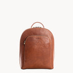 Tan leather backpack on a white background