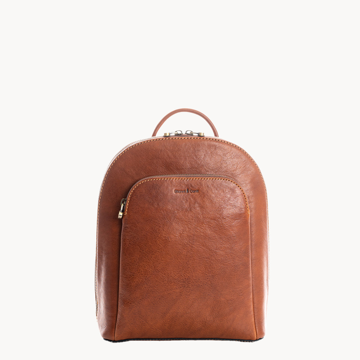 Tan leather backpack on a white background