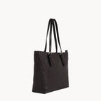 Black tote bag with shoulder straps on a white background