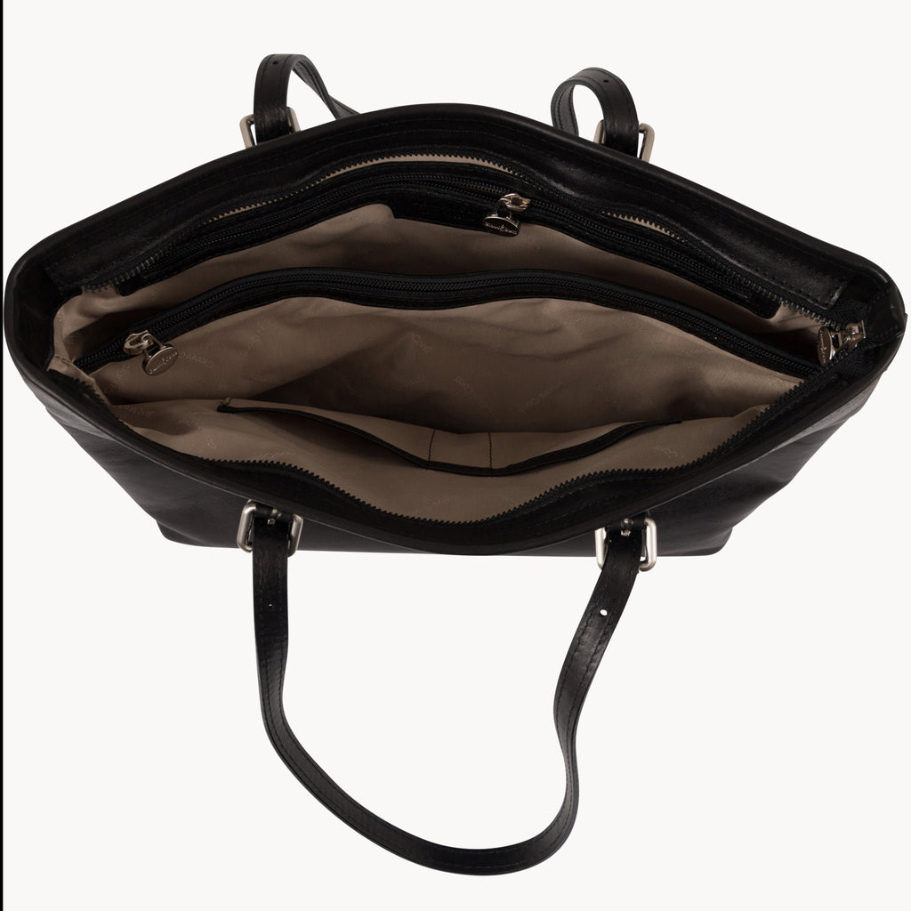 Black leather handbag with open front compartment on a white background