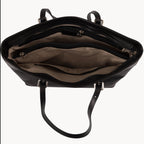 Black leather handbag with open front compartment on a white background