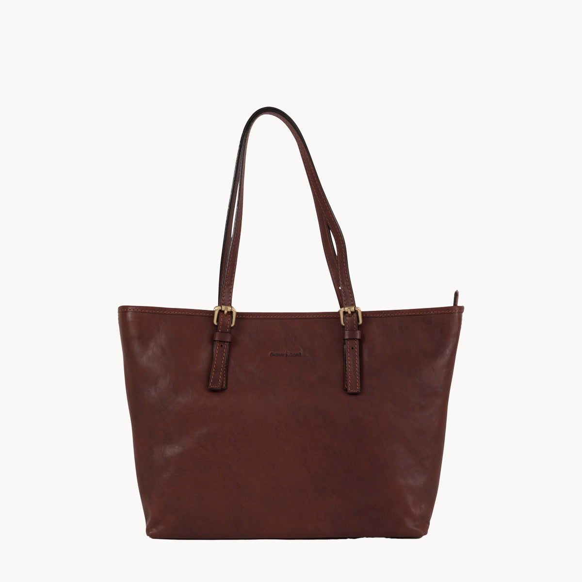 Brown leather tote bag on a white background