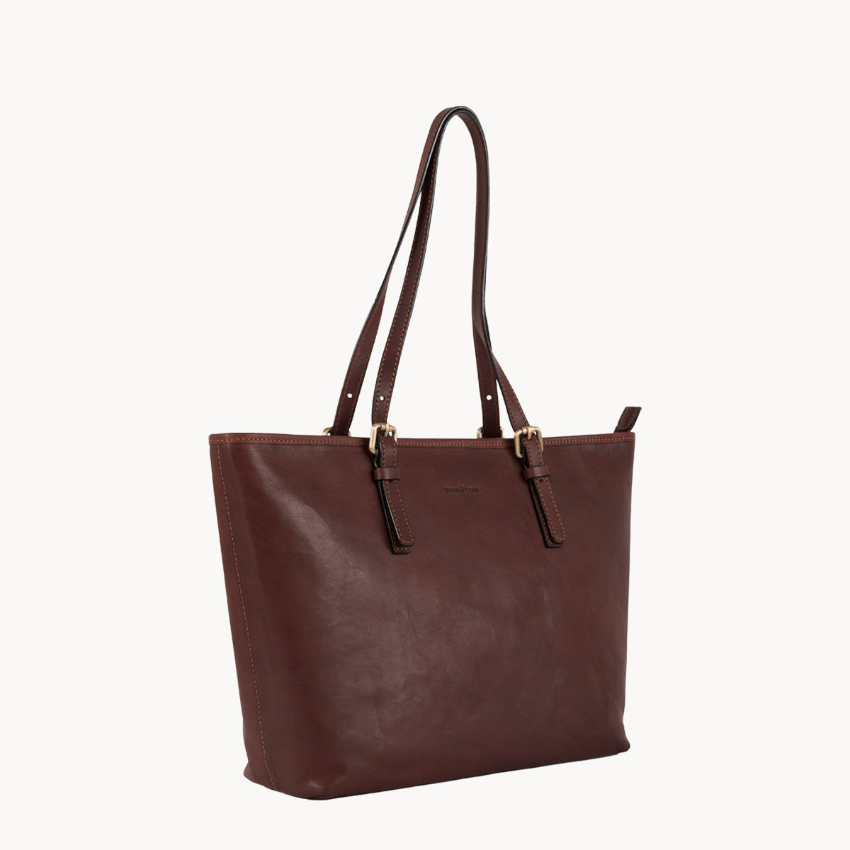 Brown leather tote bag on a white background