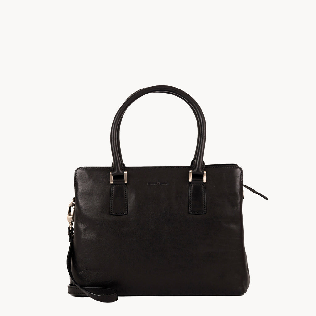 Black handbag with a strap on a white background