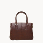 Brown leather handbag on a white background