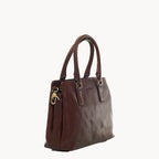 Brown leather handbag with gold accents on a white background