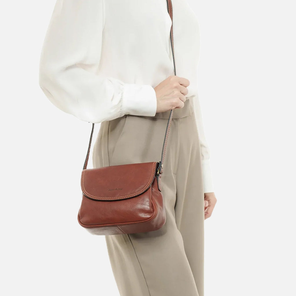 Gianni Conti Classic Leather Flap Crossbody Bag in Tan - rear view with adjustable shoulder strap