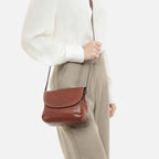 Gianni Conti Classic Leather Flap Crossbody Bag in Tan - rear view with adjustable shoulder strap