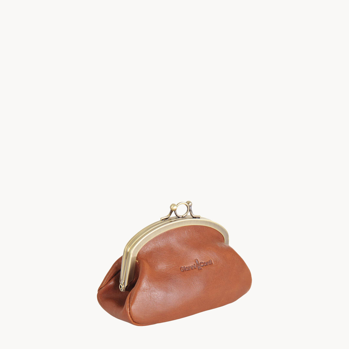 Tan leather coin purse with gold clip clasp on a white background
