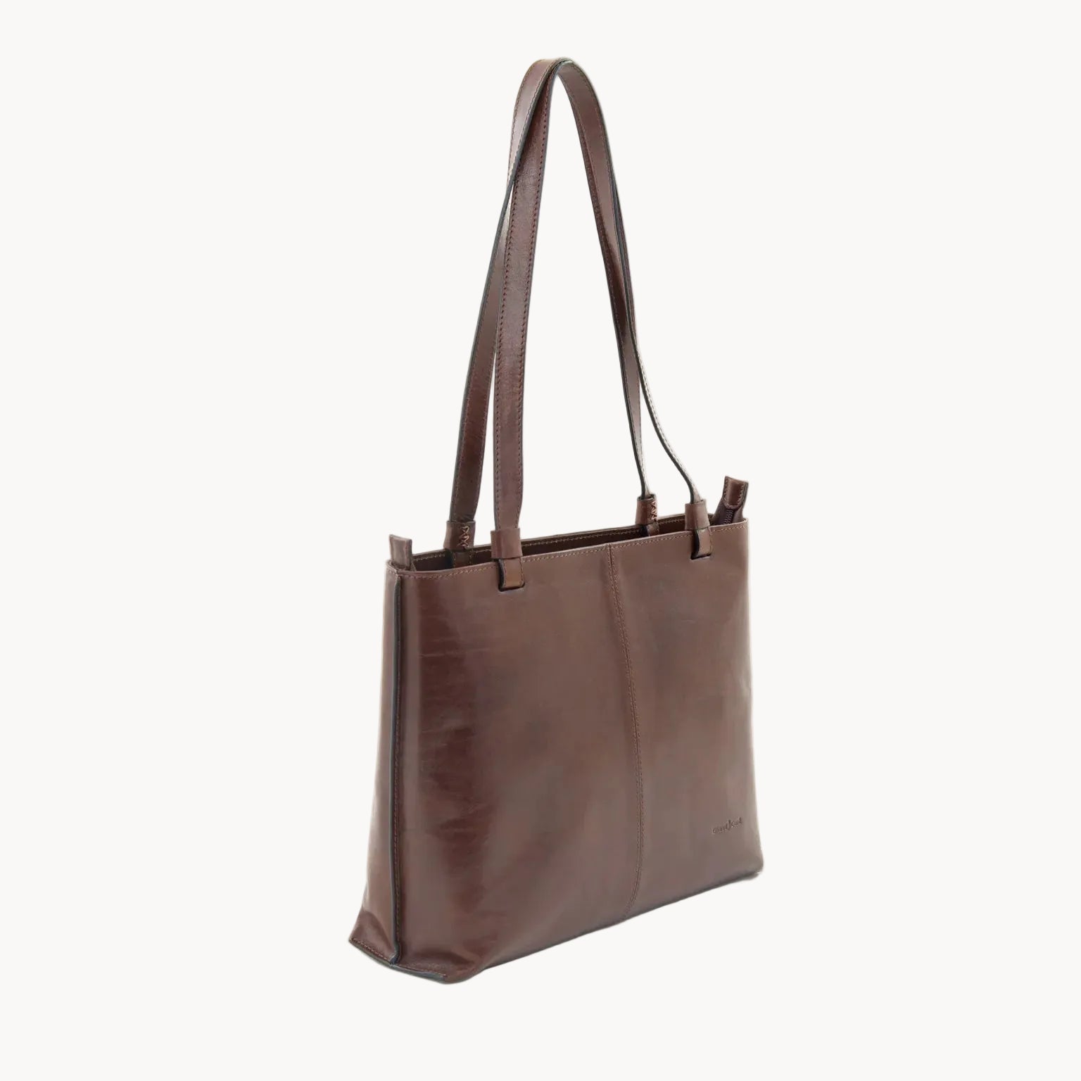 Brown leather tote bag on a white background