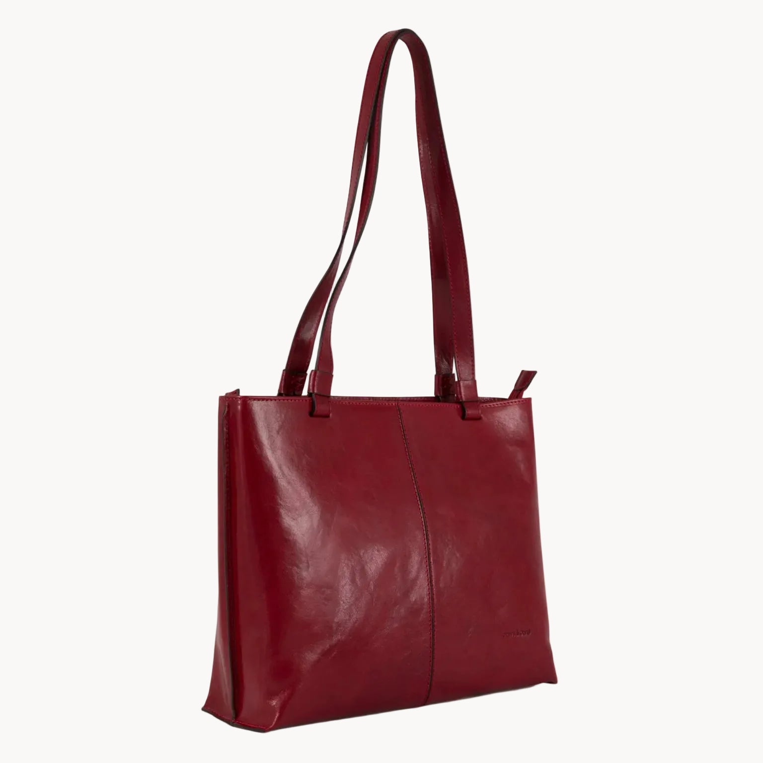 Red leather tote bag on a white background