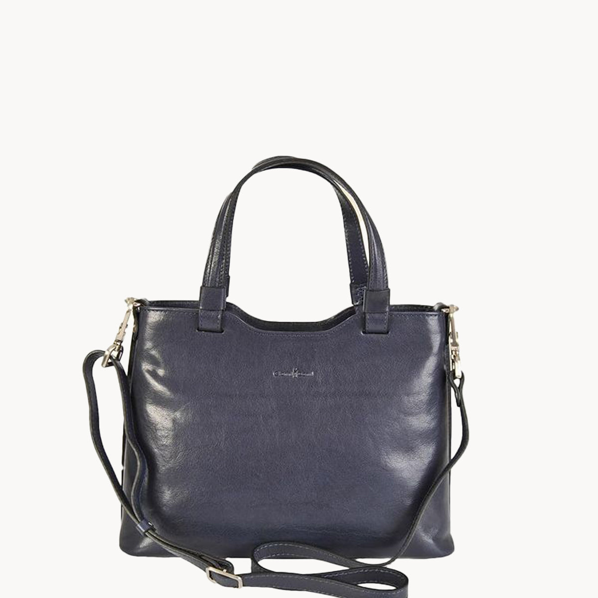 Navy blue handbag with a shoulder strap on a white background