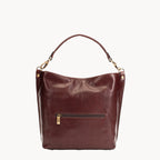 Brown leather handbag with gold accents on a white background