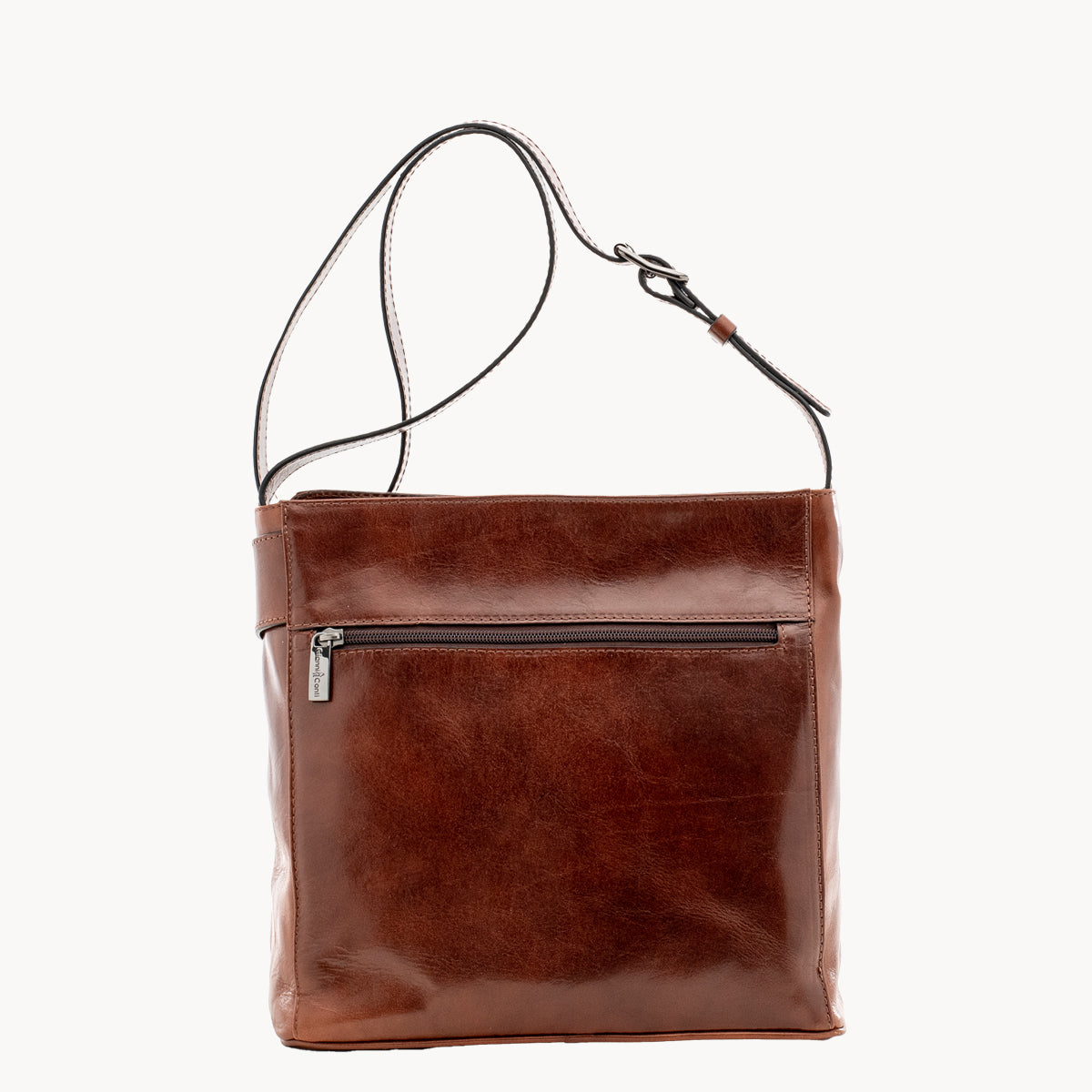 Brown leather bag with a shoulder strap on a white background