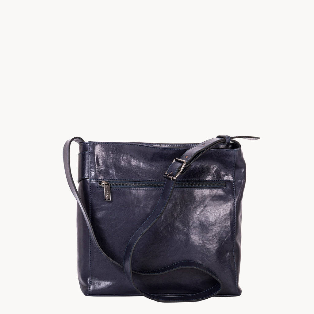 Navy blue leather handbag on a white background