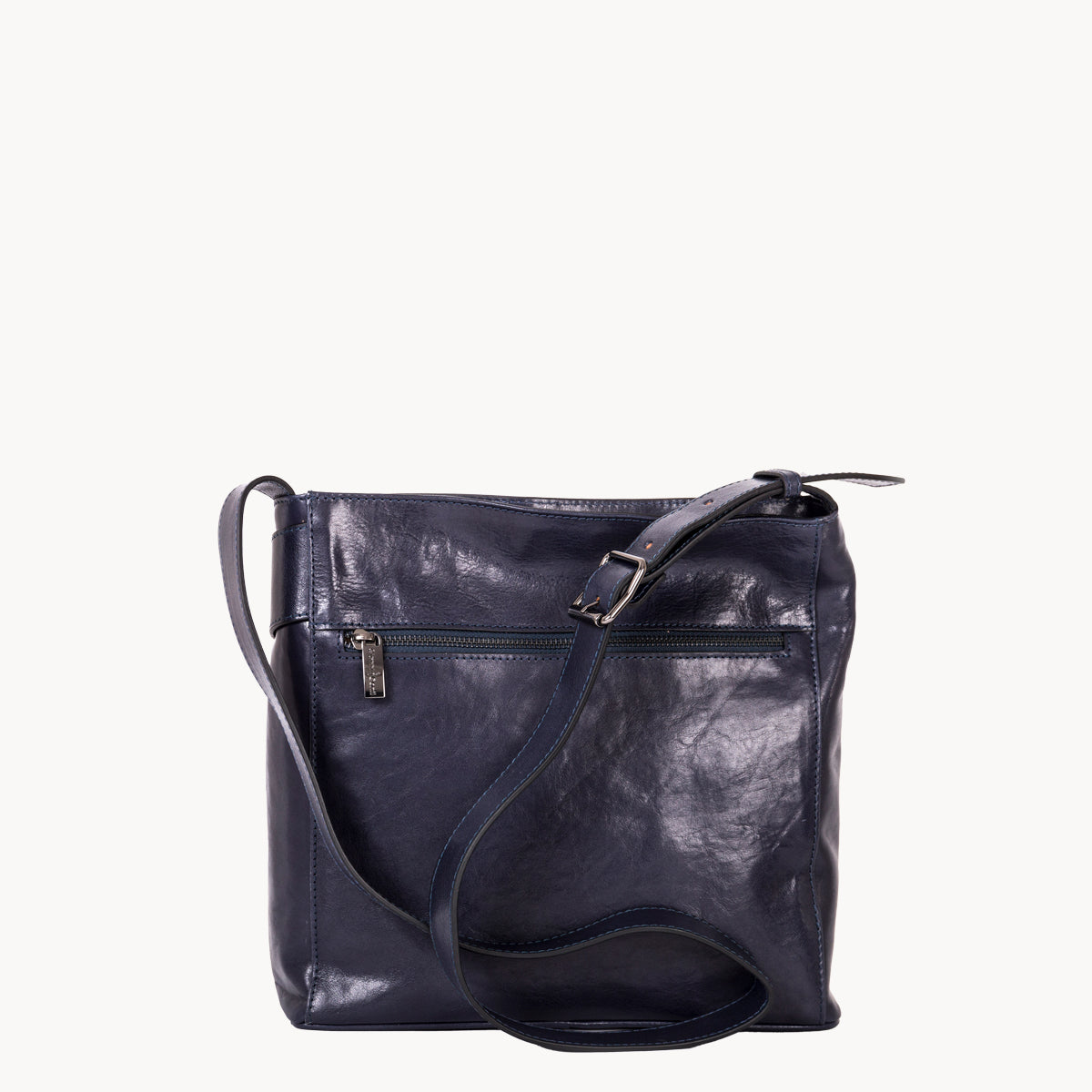 Navy blue leather handbag on a white background