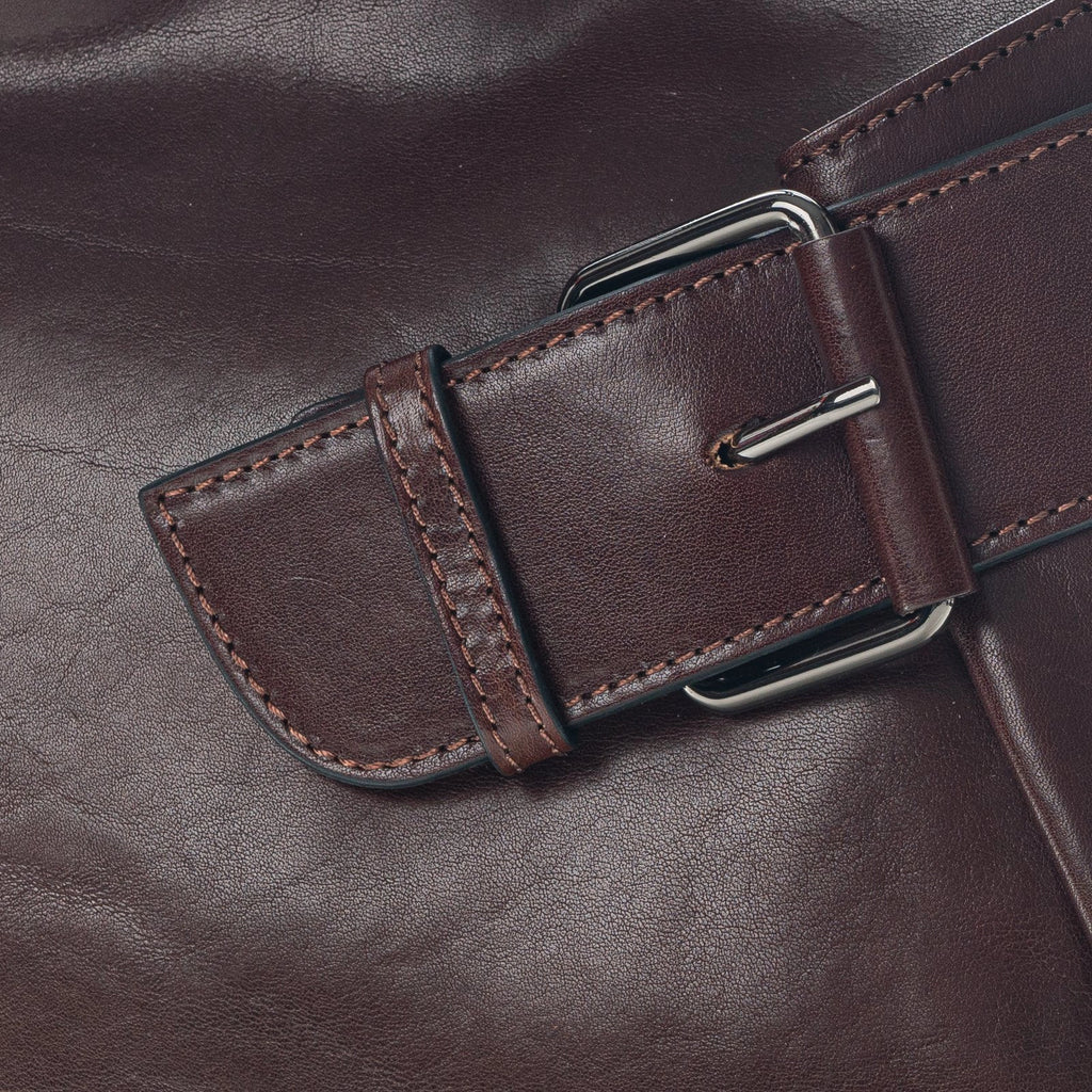 Gianni Conti brown crossbody bag with wide shoulder strap and close up buckle detail