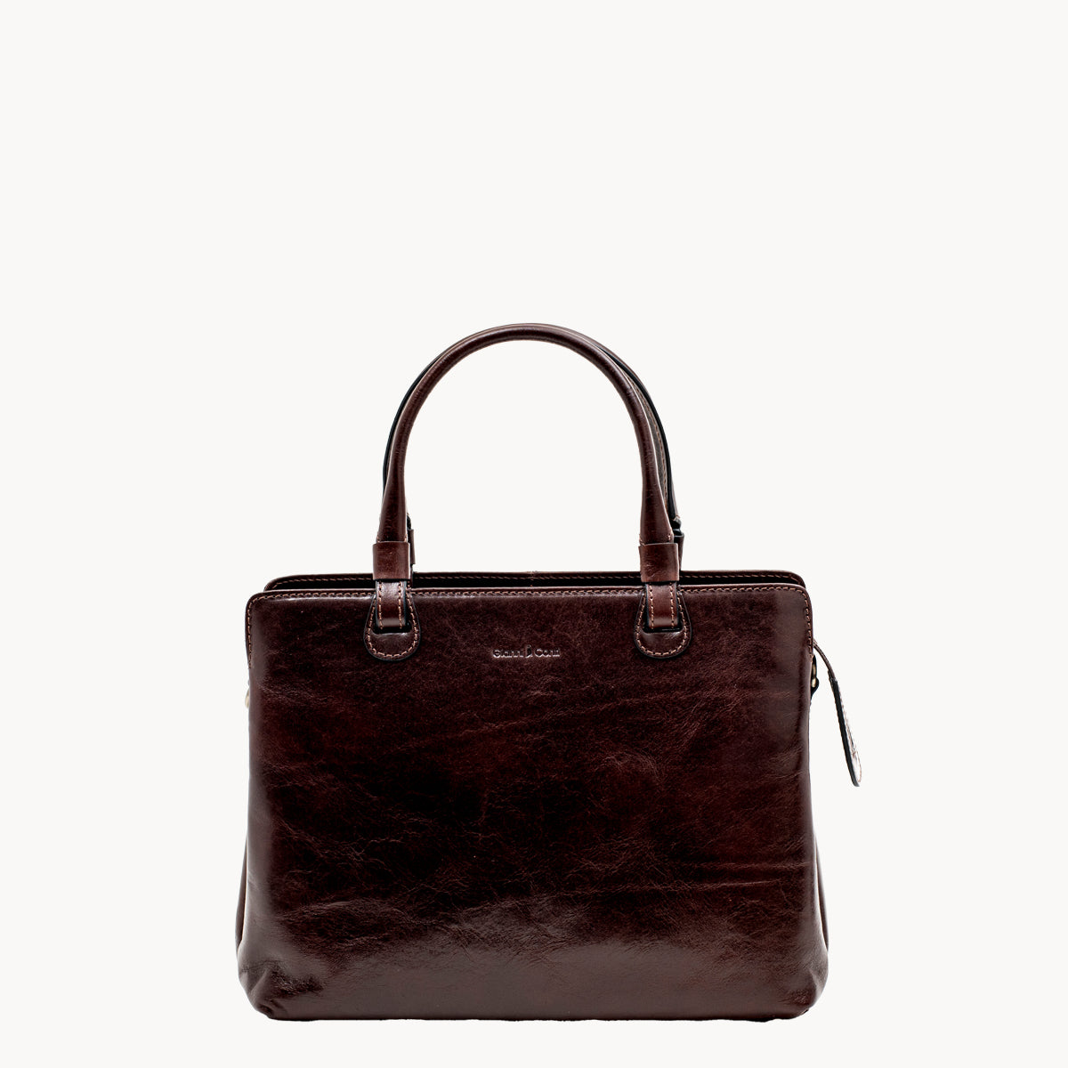 Brown leather handbag on a white background