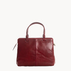 Red leather handbag on a white background