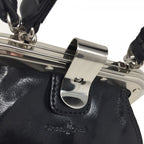 Close-up of frame clasp and Italian leather texture