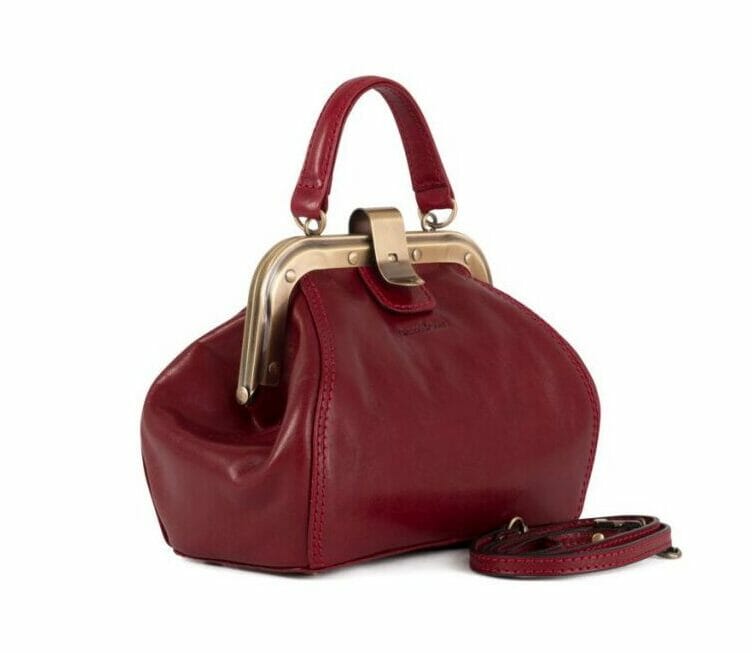 Side view of compact Gladstone bag with protective metal feet