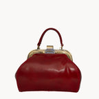 Gianni Conti Small Leather Gladstone Bag - Doctor's Bag in Red - lifestyle shot showing compact elegant style