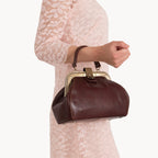 Gianni Conti Small Leather Gladstone Bag - Doctor's Bag in Tan - lifestyle shot showing compact elegant style