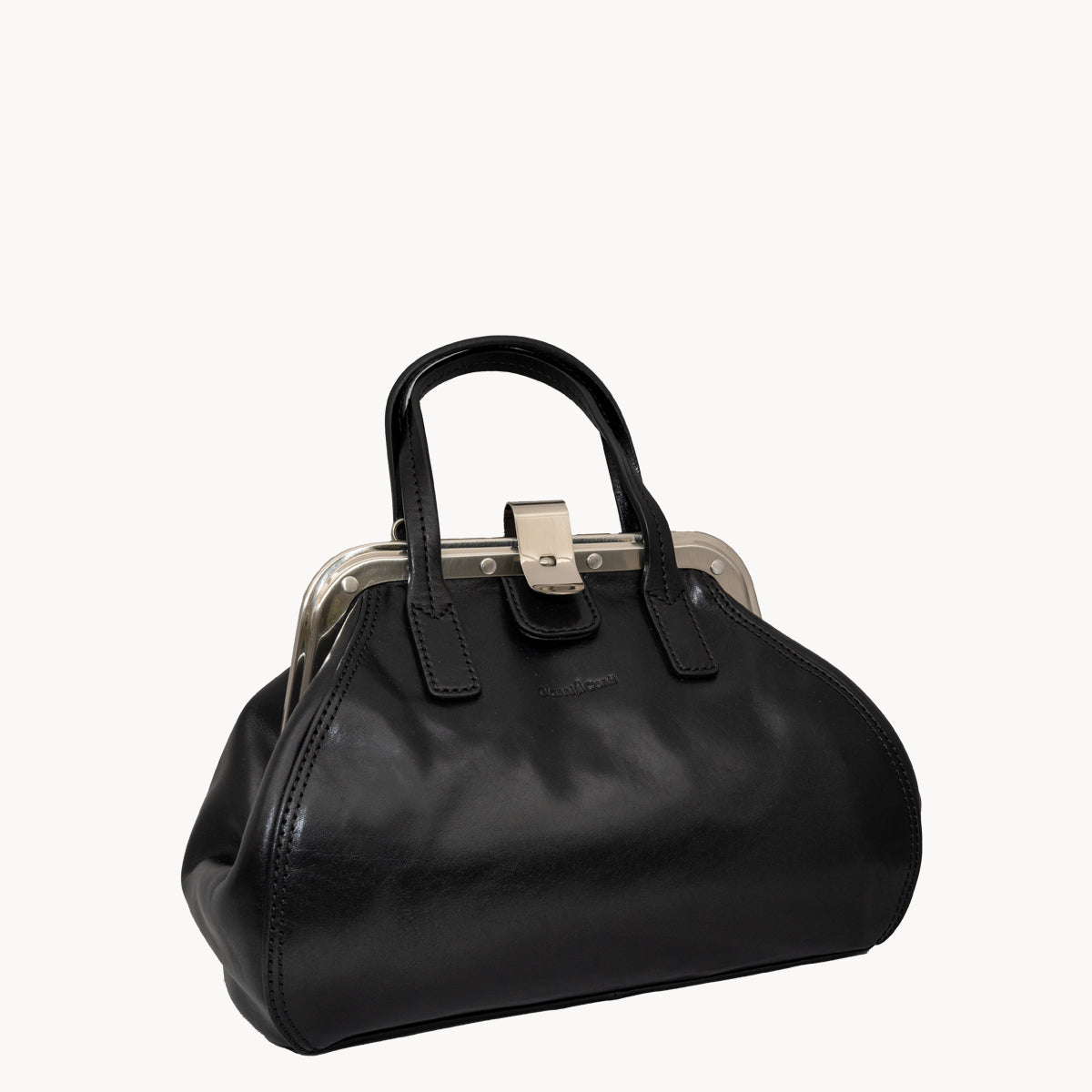 Black handbag with a metallic clasp on a white background