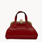 Red handbag with a gold clasp on a white background