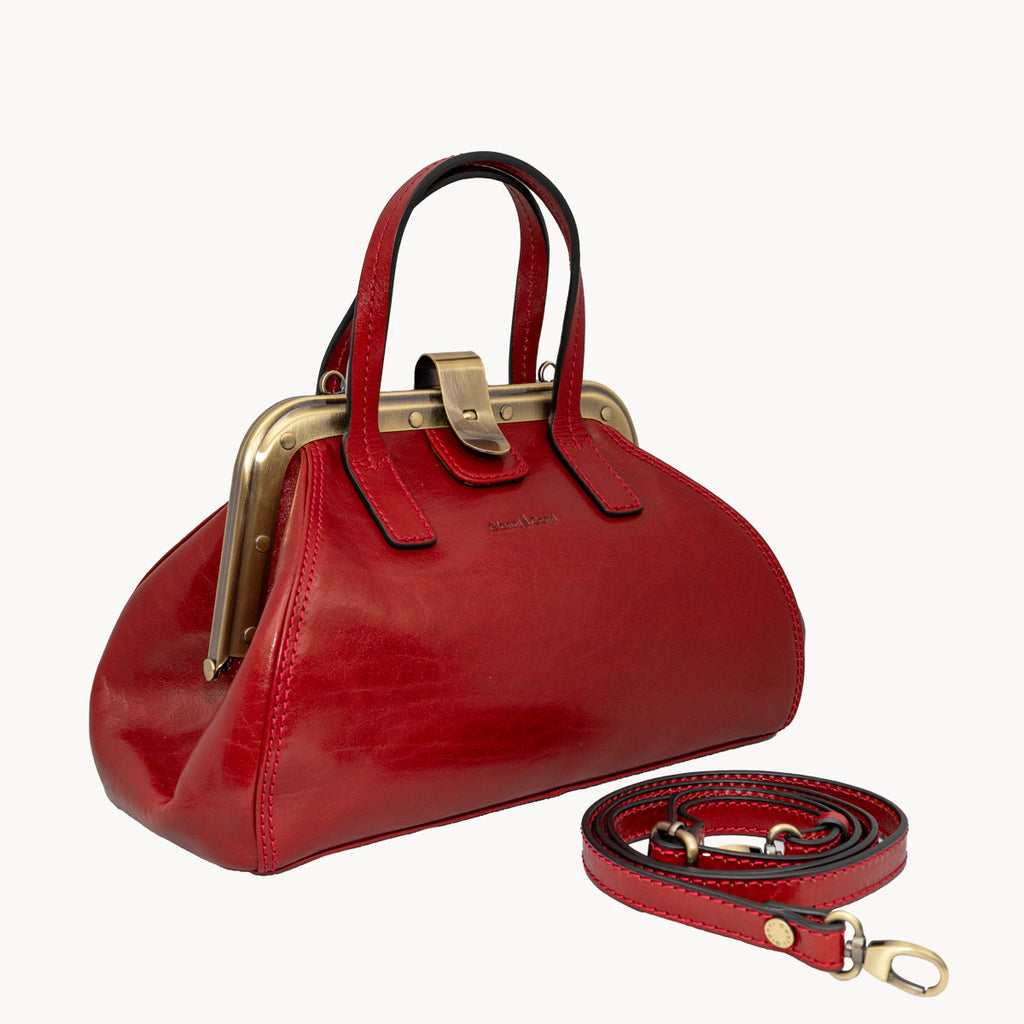 Red handbag with gold accents on a white background