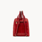 Red leather backpack on a white background