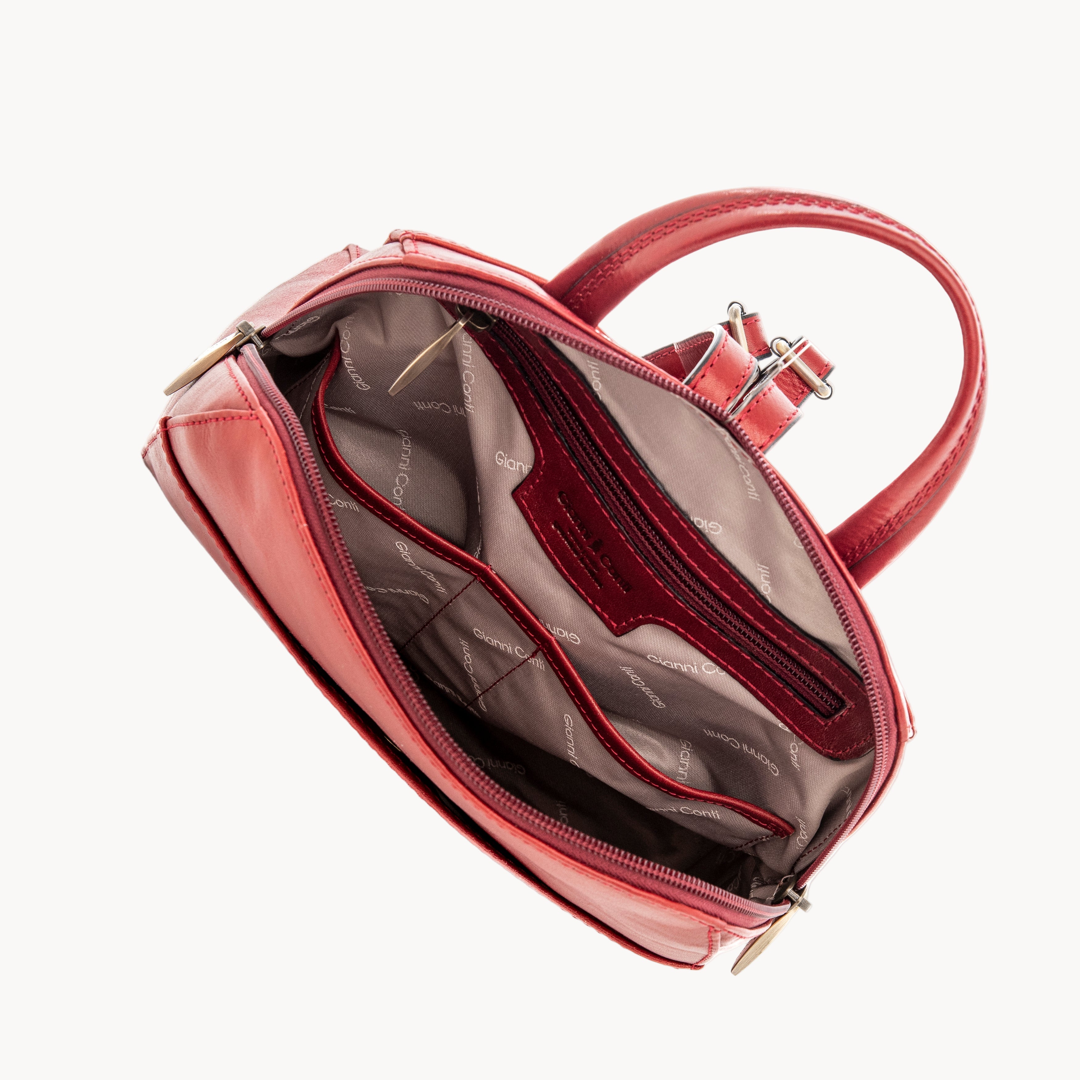 Red handbag with gold hardware on a white background