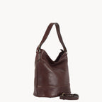 Brown leather handbag on a white background