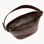 Brown leather handbag with a visible brand logo on a white background