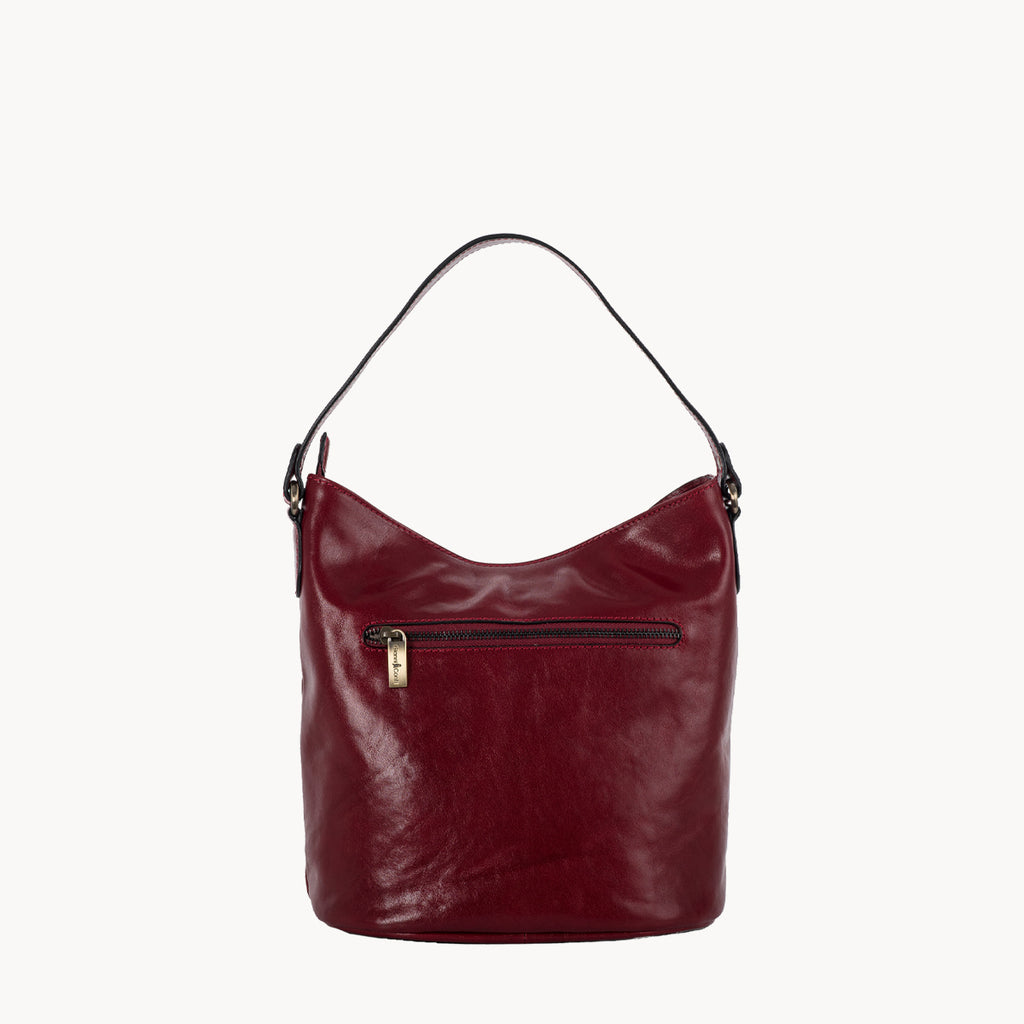 Red handbag with a gold zipper on a white background