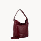 Red leather handbag on a white background