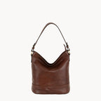 Brown leather handbag on a white background