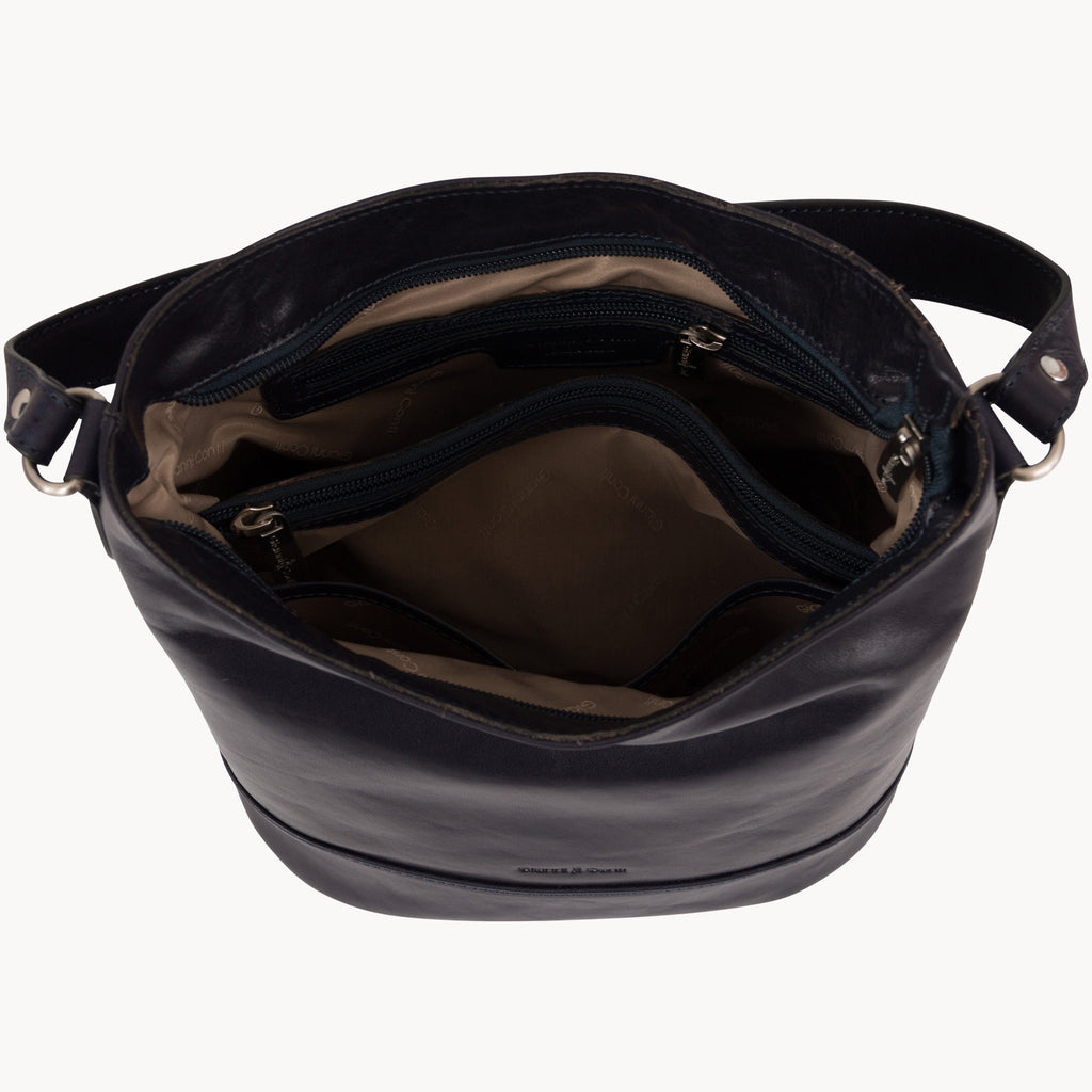 Blue leather handbag with a visible brand name on a white background